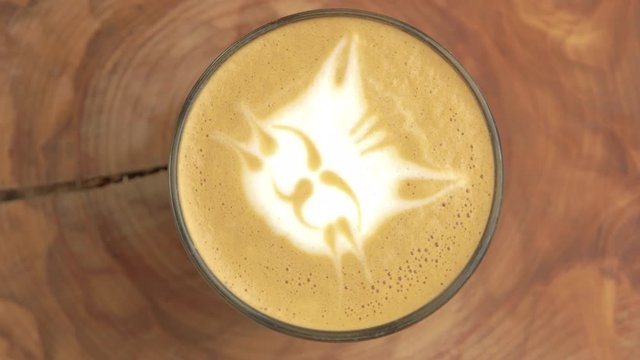 Cat latte art. Close up of coffee foam.