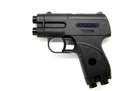 Aerosol pistol, gas weapon on a white background