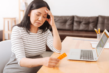 Sick pregnant woman having a headache