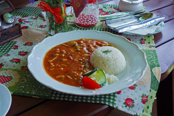 Spicy chicken slices and rice, annex, table in the restaurant