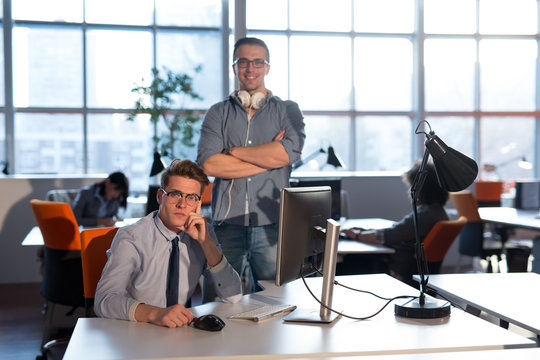 Two Business People Working With computer in office