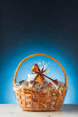 Fototapeta na wymiar gift basket on blue background