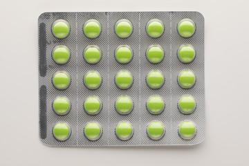 blister pack with green pills