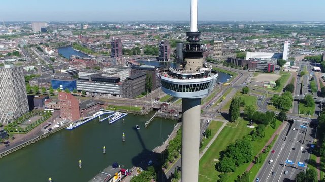 Aerial footage circling around Euromast an observation tower in Rotterdam Netherlands it was specially built for the 1960 Floriade and is a listed monument since 2010 very tall structure 4k quality