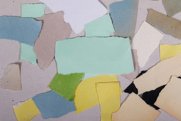 Many colorful cut pieces of paper 