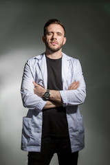 Fototapeta premium Student at a medical College in a white robe, a haughty look