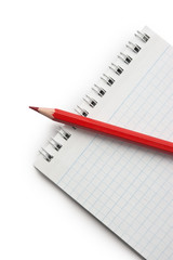 red pencils and notebook