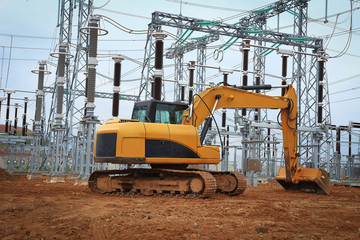 Excavator in industrial construction of electrical substation
