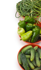 green peppers, cucumbers and garlic in a bowl