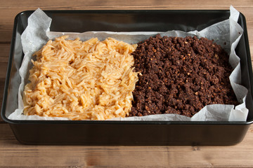 Cooking Process Of Homebaked Pie With Apple And Chocolate Parts. Raw Dough In Tray.