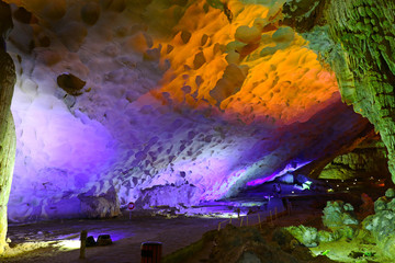 Cave on island at Halong Bay Vietnam.  Illuminated by light.
