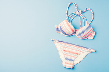 Colorful swimsuit on blue background - 162416257