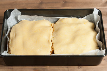 Cooking Process Of Homebaked Pie With Apple And Chocolate Parts. Raw Dough In Tray.