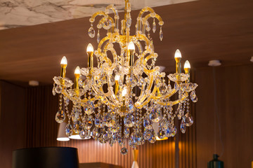 Beautiful chandelier. luxury expensive chandelier hanging under ceiling
