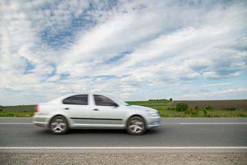 Plakat Driving a car on highway, motion blur