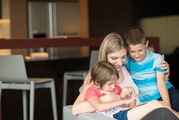 Young Family Using A Tablet To Make Future Plans