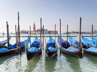 Fototapeta na wymiar Gondolas moored on the Grand Canal near Piazza San Marco Venice