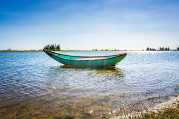 Fototapeta premium Alone boat in river. HDR