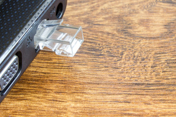 Connecting lan port to laptop computer isolated on white background.Concept laptop without internet