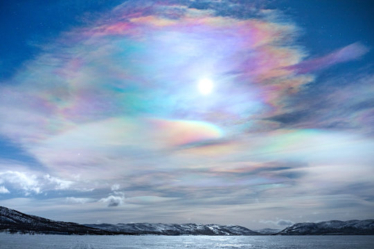 Scenic view of frozen lake against polar stratospheric clouds