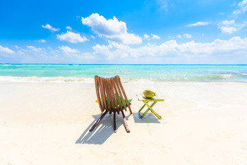 Relaxing on chair at paradise beach and city at caribbean coast of Quintana Roo, Mexico