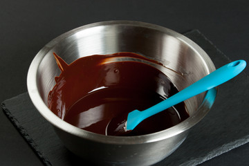 Melted Dark Chocolate In Bowl. Cooking Process Of Brownies.