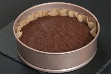 Homebaked Chocolate Brownie. Baking Tin. Parchment Paper. Slate Stone.