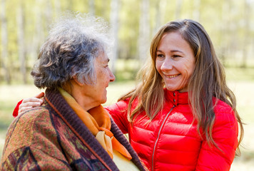 Happy elderly woman with her daughter