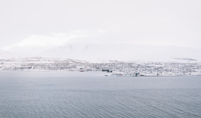 Panoramic view on winter Akureyri with a mountain on the background, Iceland