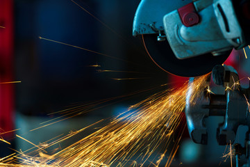 Angular grinding machine is cutting the metal