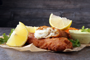 traditional British fish and chips on brown paper