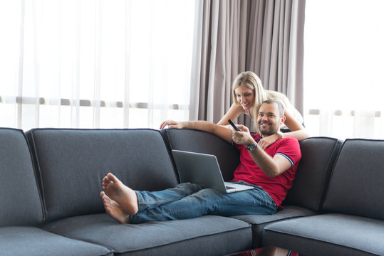 happy couple relaxes in the living room