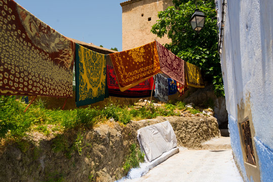carpets drying after laundry in chefchaouen, morocco