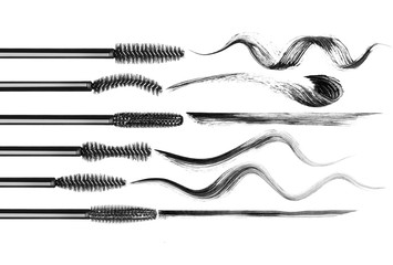Set of various mascara brushes with mascara strokes on white background