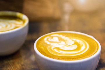 Soft focus on latte coffee cup, coffee for background - vintage effect process picture