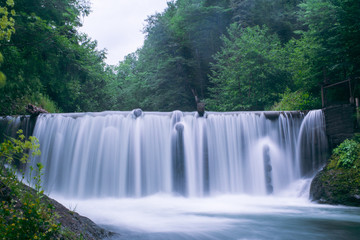 waterfall in the green forest on a long exposure