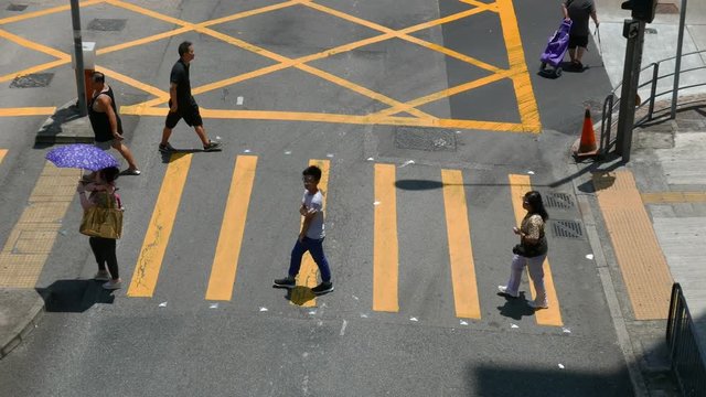 Top view of People crossing street in busy road 