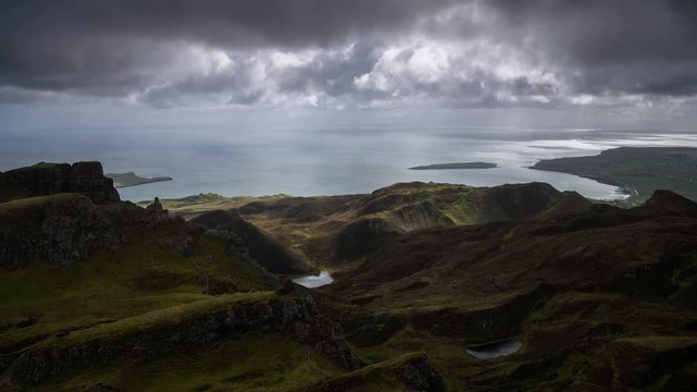 Heavy low clouds moving over the Staffin Bay and Staffin Island from Quiraing.  Isle of Skye, Scotland. 4k Time lapse