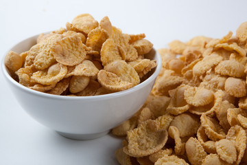 Bowl with popcorn on a white table