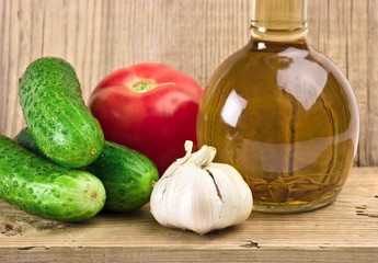 vegetables and a bottle of oil, still life