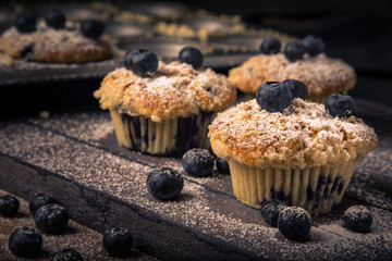 blueberry muffin, wood background, horizontal