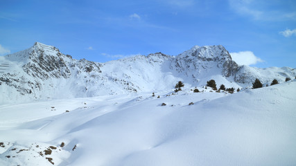Fototapeta na wymiar Winter mountain panoramic landscape with fresh snow on skiing tracks, Les Arcs slopes, Alps, France