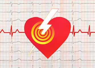 Heart with electrocardiogram test in the background, cardiology concept