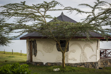 African house on the shore of the lake