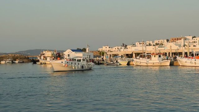Fishing local boat leaving the port of Naoussa at Paros island in Greece.