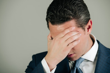 Unhappy man with headache and stylish hair