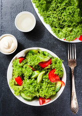 vegetables salad. Delicious vegetarian food or diet concept on dark background