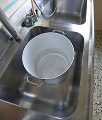 Large industrial sink of a restaurant for washing pots with a la