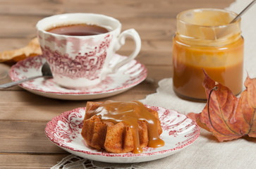 Homebaked Cake, Maple Leaf Shape. Cup Of Tea. Toffee Sauce.