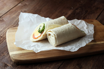 egg cheese and salomon sandwich wrap in tortilla